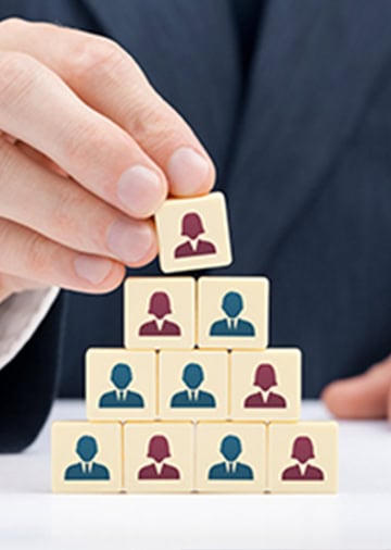 Image showing an HR manager building blocks to well-being, staff retention and staff engagement through BMS controls